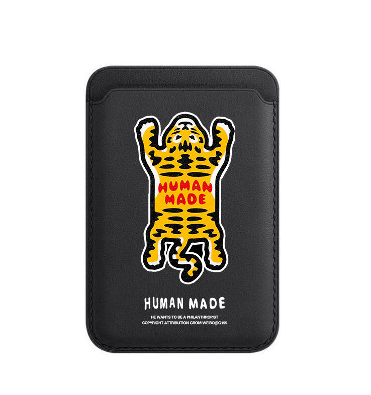 Black phone case with a tiger illustration and 'Human Made' text on a white background