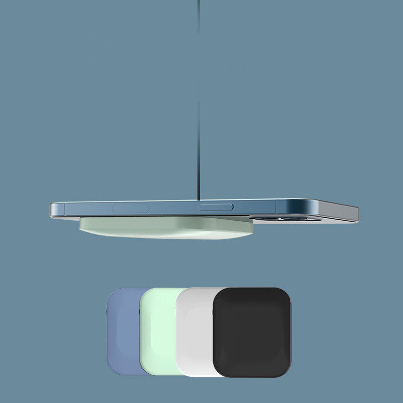 Ceiling light fixture with wireless charging pads on a blue background