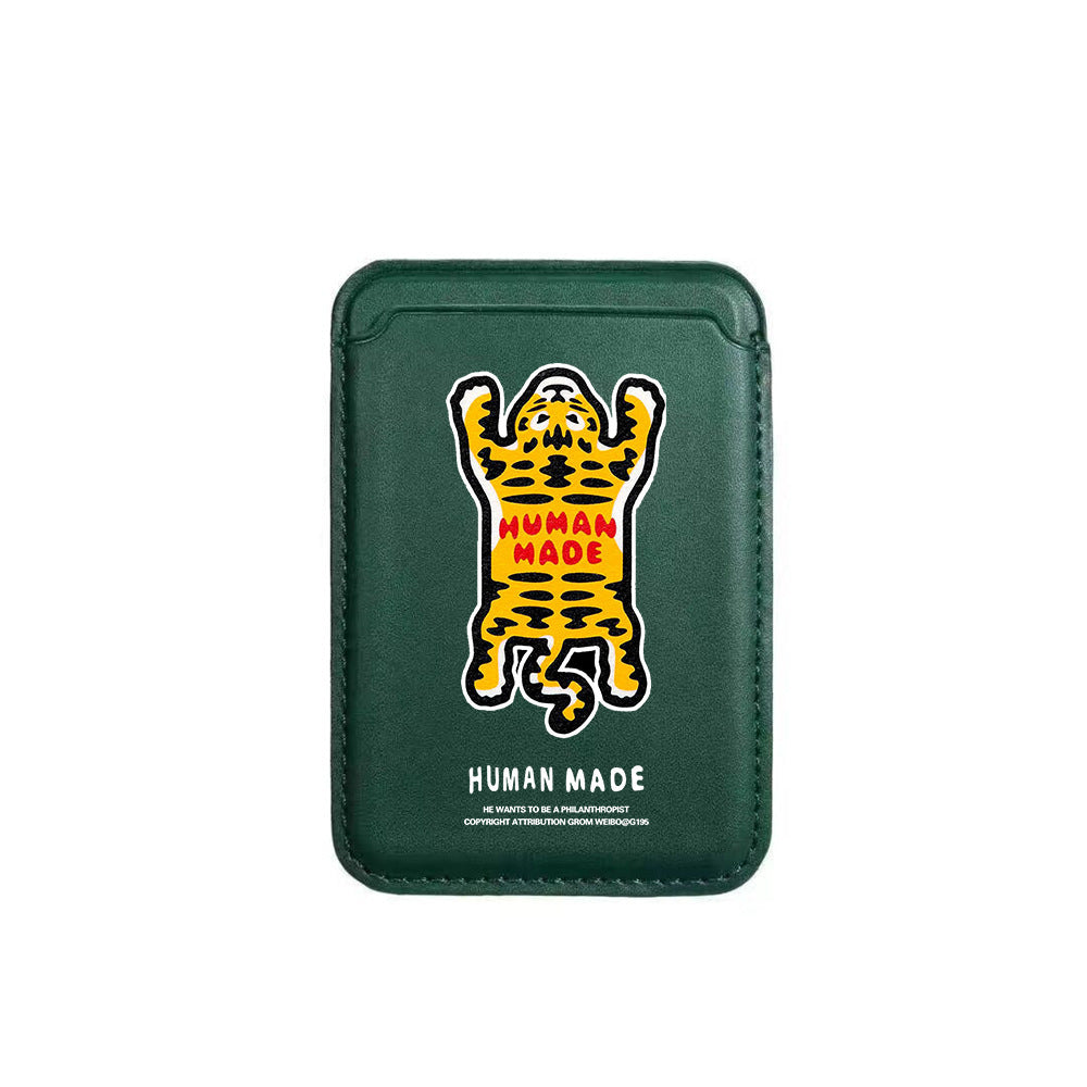 Green cardholder with a tiger design and 'Human Made' branding on a white background