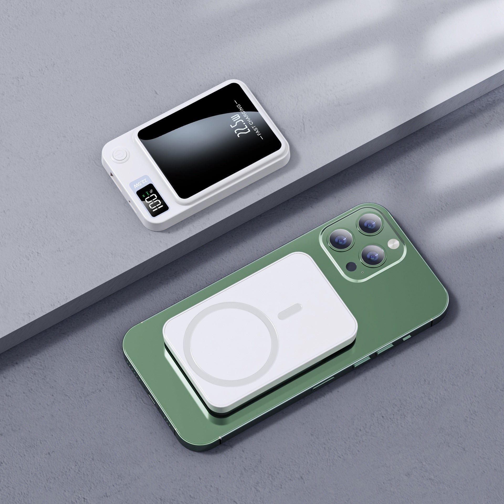 Green phone case with wireless charging pad on a gray surface