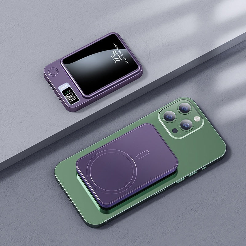 Green phone with purple wireless charging pad on a gray surface