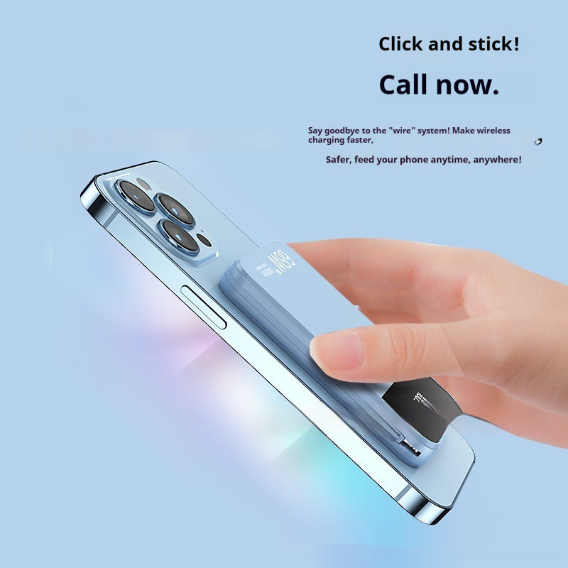 Hand holding a smartphone with wireless charging feature on a light blue background