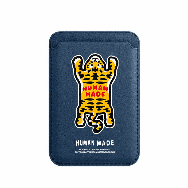 Navy blue cardholder with a yellow and black panther graphic and 'Human Made' text on a white background
