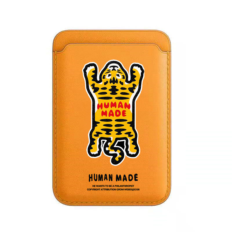 Orange phone case with a leopard graphic and 'Human Made' text on a white background