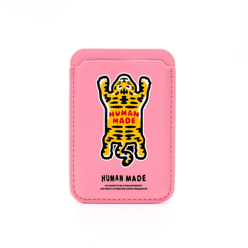Pink cardholder with a tiger illustration and 'Human Made' branding on a white background