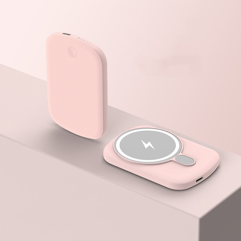 Pink wireless charging pad on a light pink background