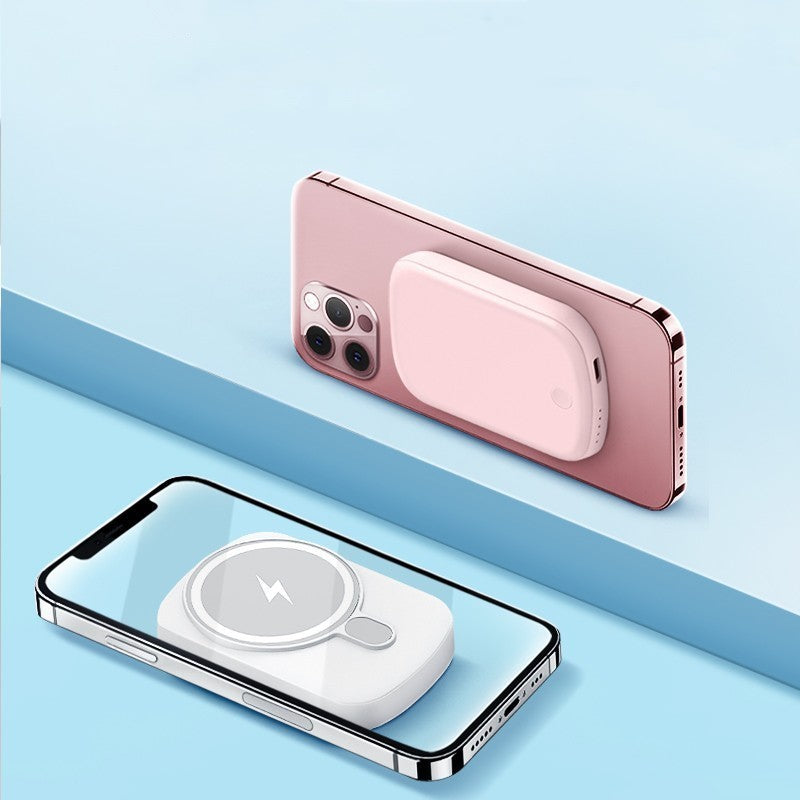 Rose gold phone case and wireless charging pad on a light blue background