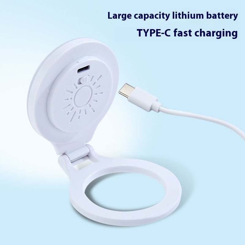 White electronic device with a charging cable on a light blue background