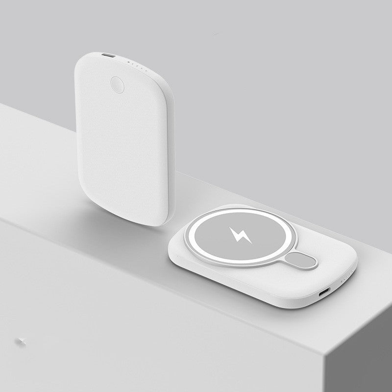 White wireless charging pad on a light gray surface