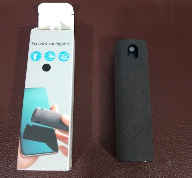 Screen cleaning mist device with packaging on a brown surface