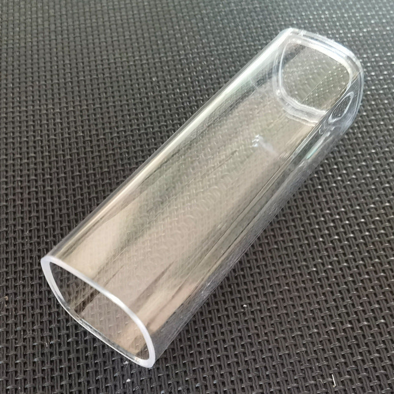Clear plastic tube on a textured black surface