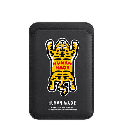 Black phone case with a tiger illustration and 'Human Made' text on a white background