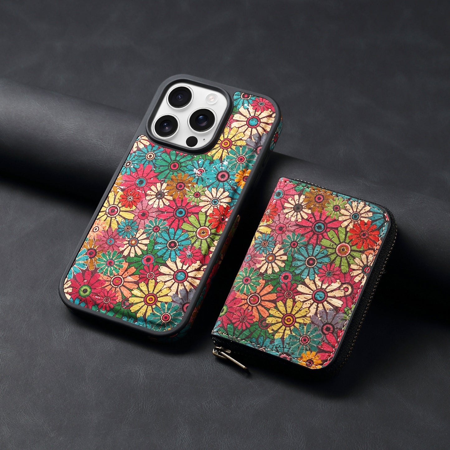 Colorful floral phone case and wallet on a dark background