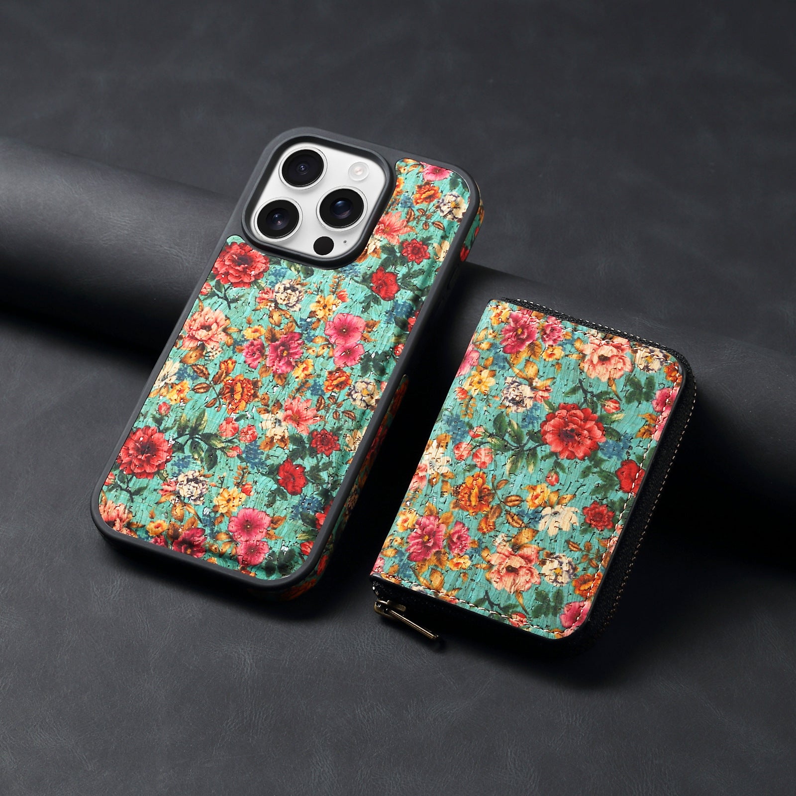 Floral patterned phone case with a zipper on a dark background