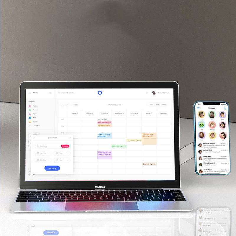 Laptop and smartphone displaying a calendar application on a reflective surface with a dark background