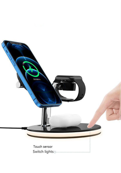 Multi-device charging stand with smartphone, smartwatch, and wireless charger on a white background
