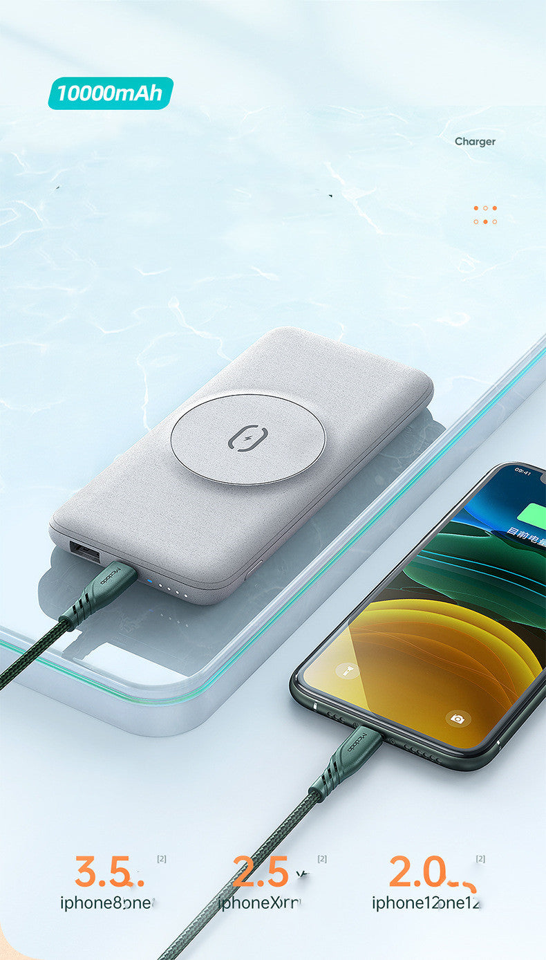 Portable power bank with charging cable and smartphone on a light blue background