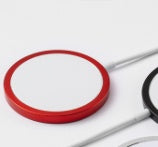 Red circular object with a white center on a gray background