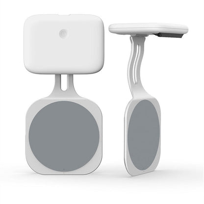 White electronic device with gray circular components on a white background